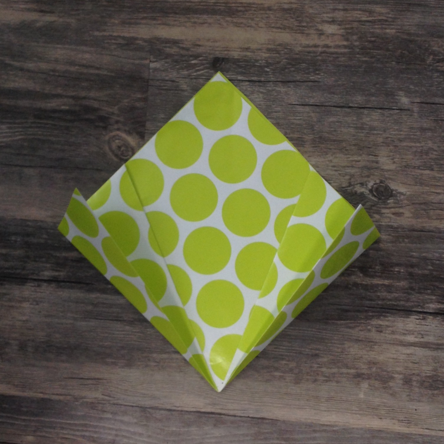 Paper Flower Origami | Folded Flower Tutorial | Origami Flower | Flower Party Decor These flowers can be made from scrapbook paper or wrapping paper to match your party or wedding decor. Simple and economical, and you can make them big or small for whatever you need them for! | Six Clever Sisters