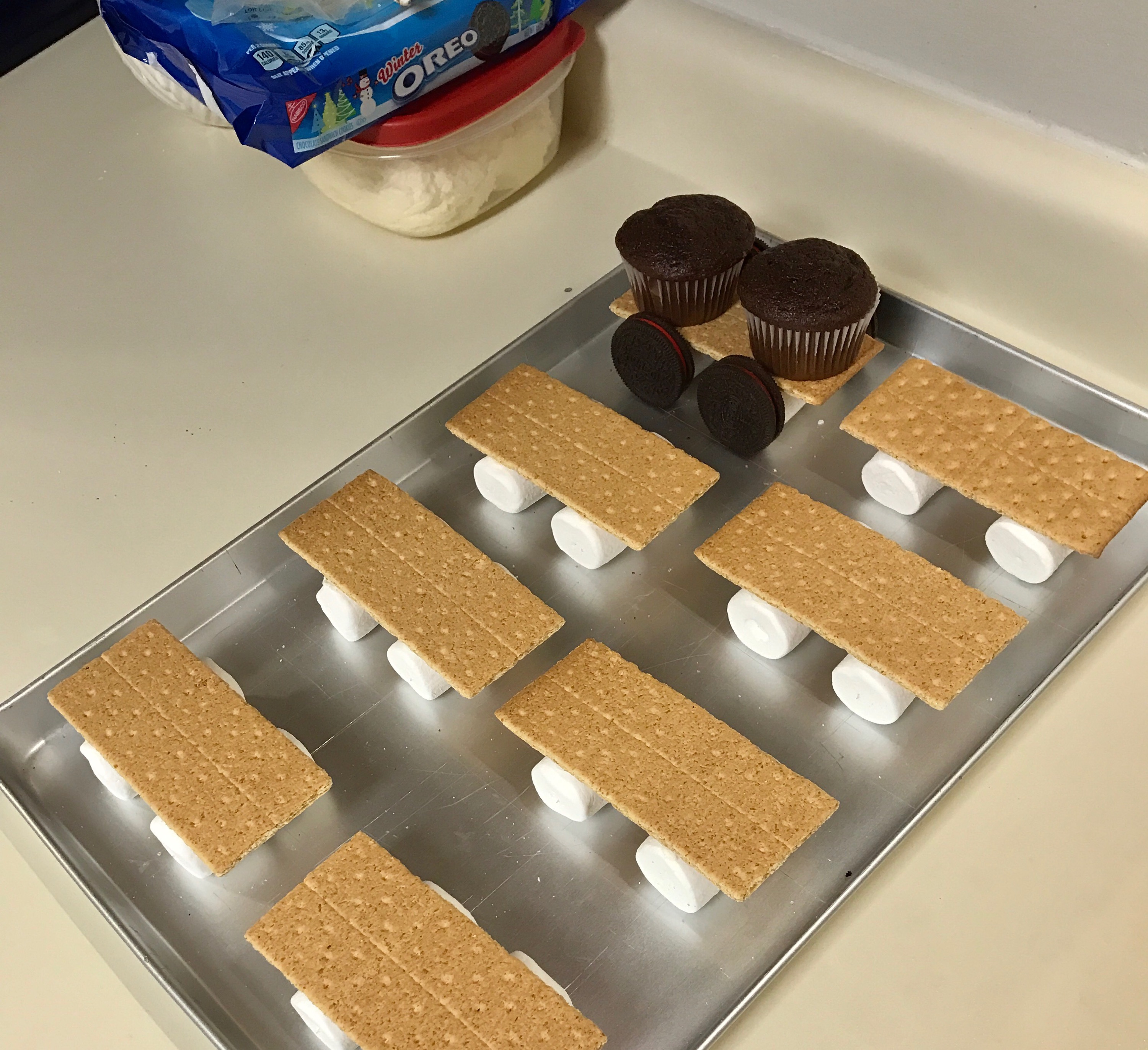 Thomas cupcake train | child birthday party | thomas the tank engine | cupcakes | birthday cake | thomas party | Make this adorable candy cupcake train for your little fella , instructions on Six Clever Sisters blog!