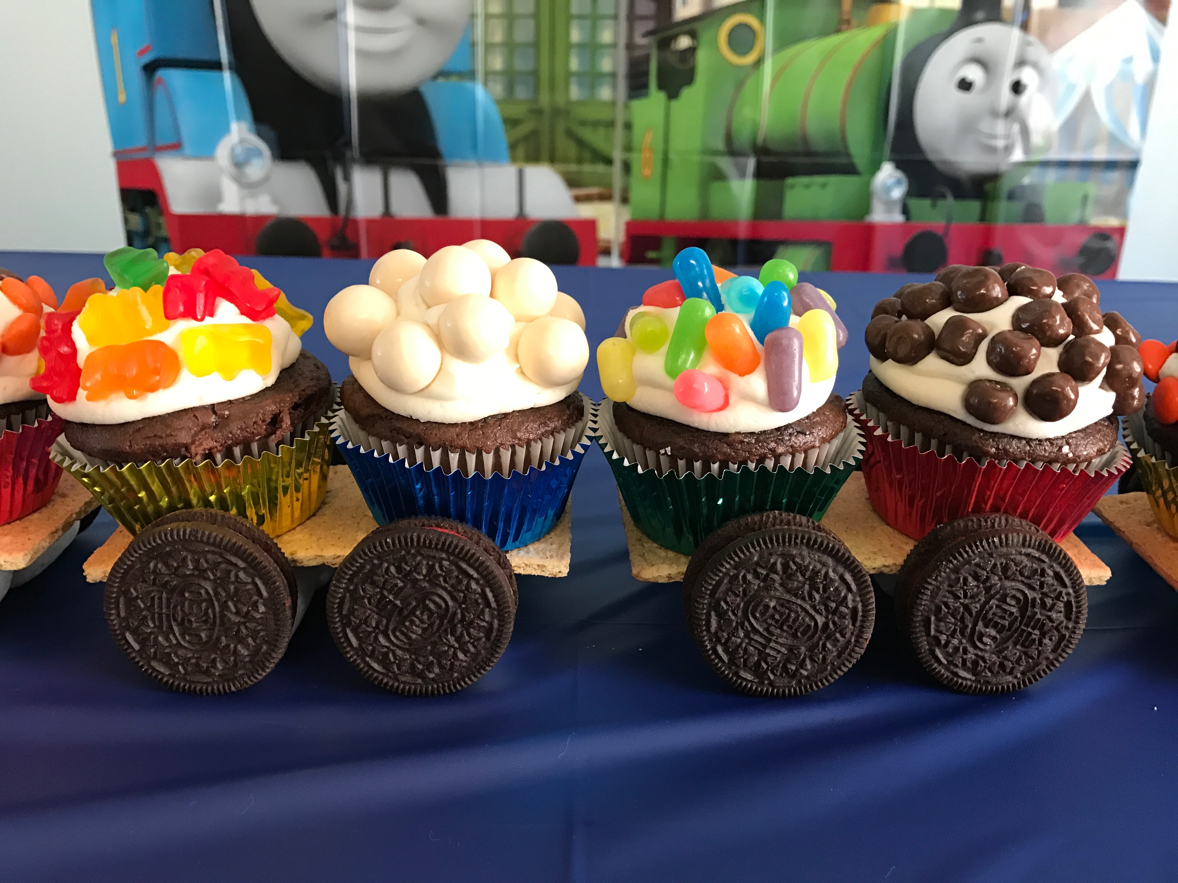Thomas cupcake train | child birthday party | thomas the tank engine | cupcakes | birthday cake | thomas party | Make this adorable candy cupcake train for your little fella , instructions on Six Clever Sisters blog!
