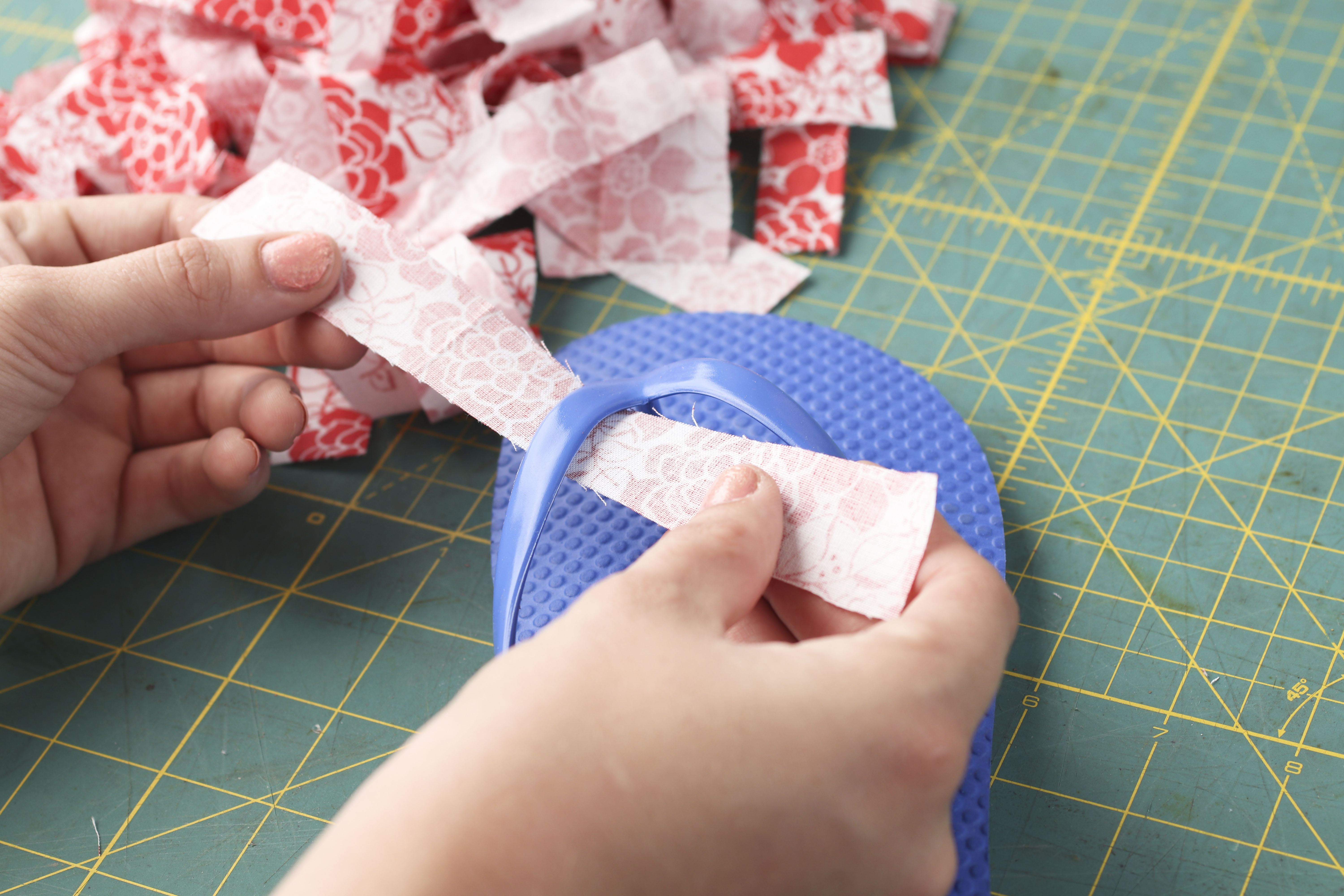 First, cut 24 strips of fabric - each strip 6" long and 1" wide.