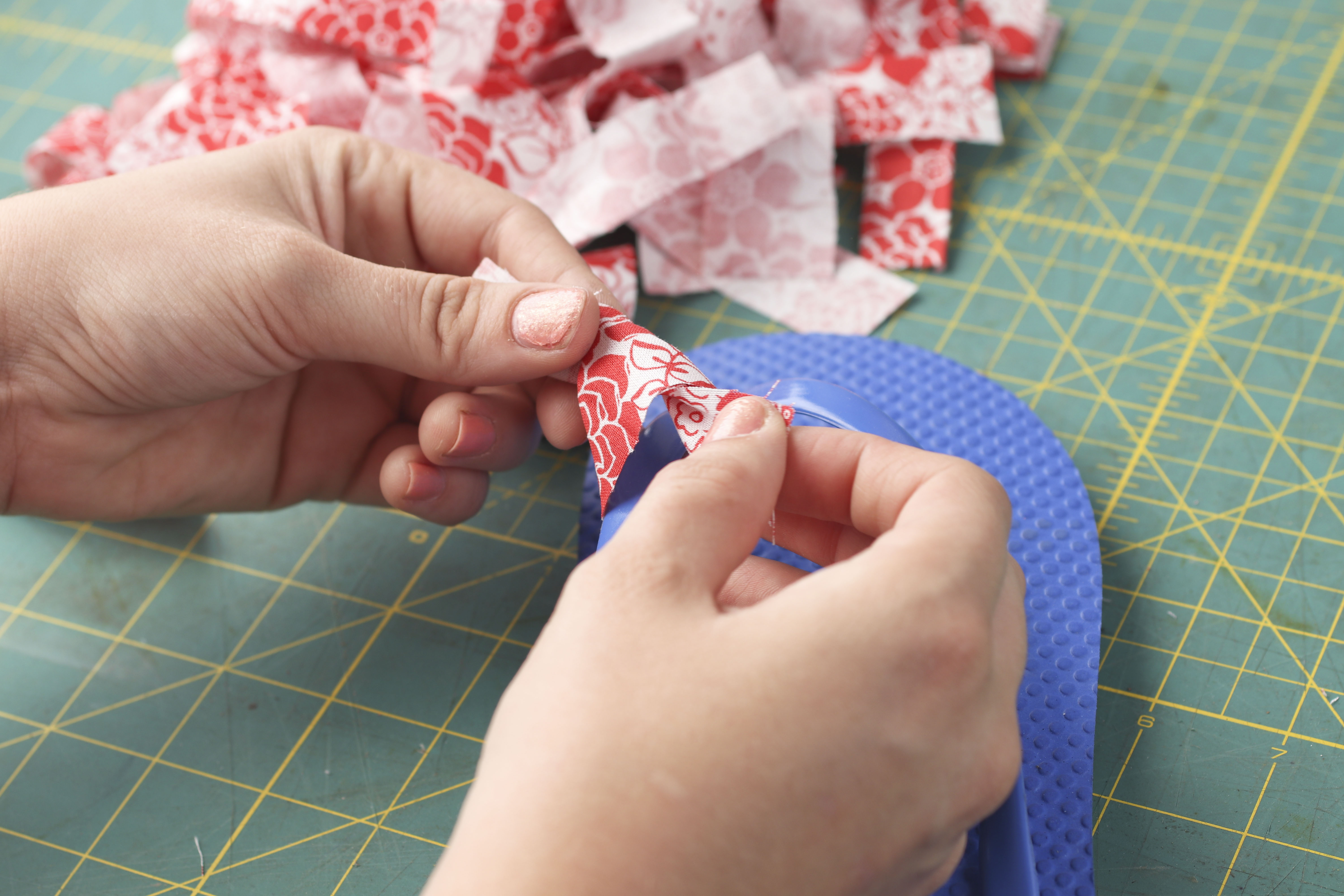 First, cut 24 strips of fabric - each strip 6" long and 1" wide.