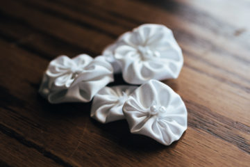 DIY Fabric Rosettes | Fabric Flower Tutorial | Learn how to make fabric rosettes in this easy tutorial from SixCleverSisters.com.