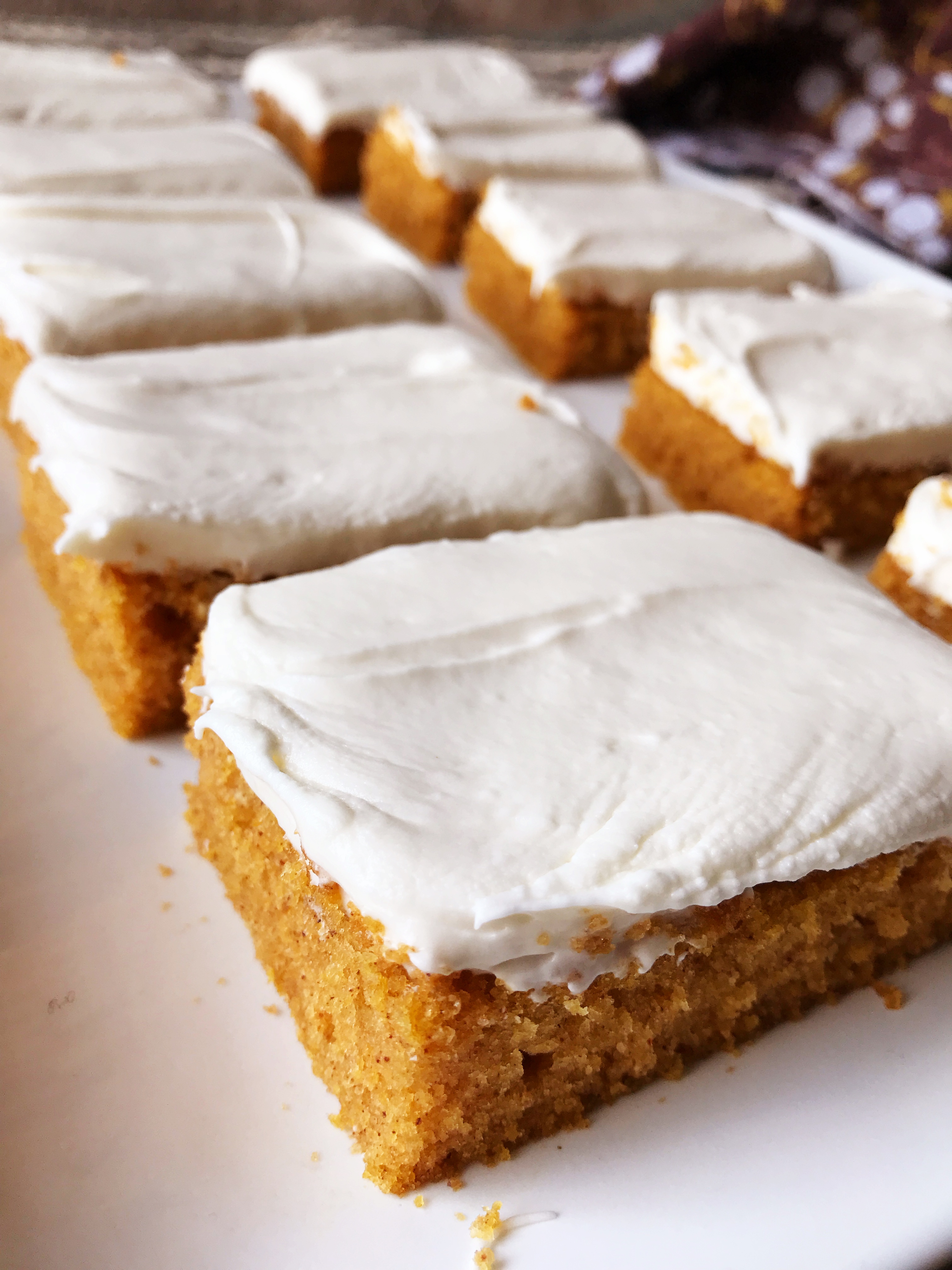 Pumpkin Bars | Sheet Cake Recipe | Fall Dessert | Sheet Cake Pan | Dessert for a Crowd | Fall | Autumn | Fall Desserts | Thanksgiving | Pumpkin Recipes | Pumpkin Dessert | Pumpkin Cake | Easy Dessert | Easy Recipe | Cream Cheese Frosting | Sheet Cake Pumpkin Bars on Six Clever Sisters!