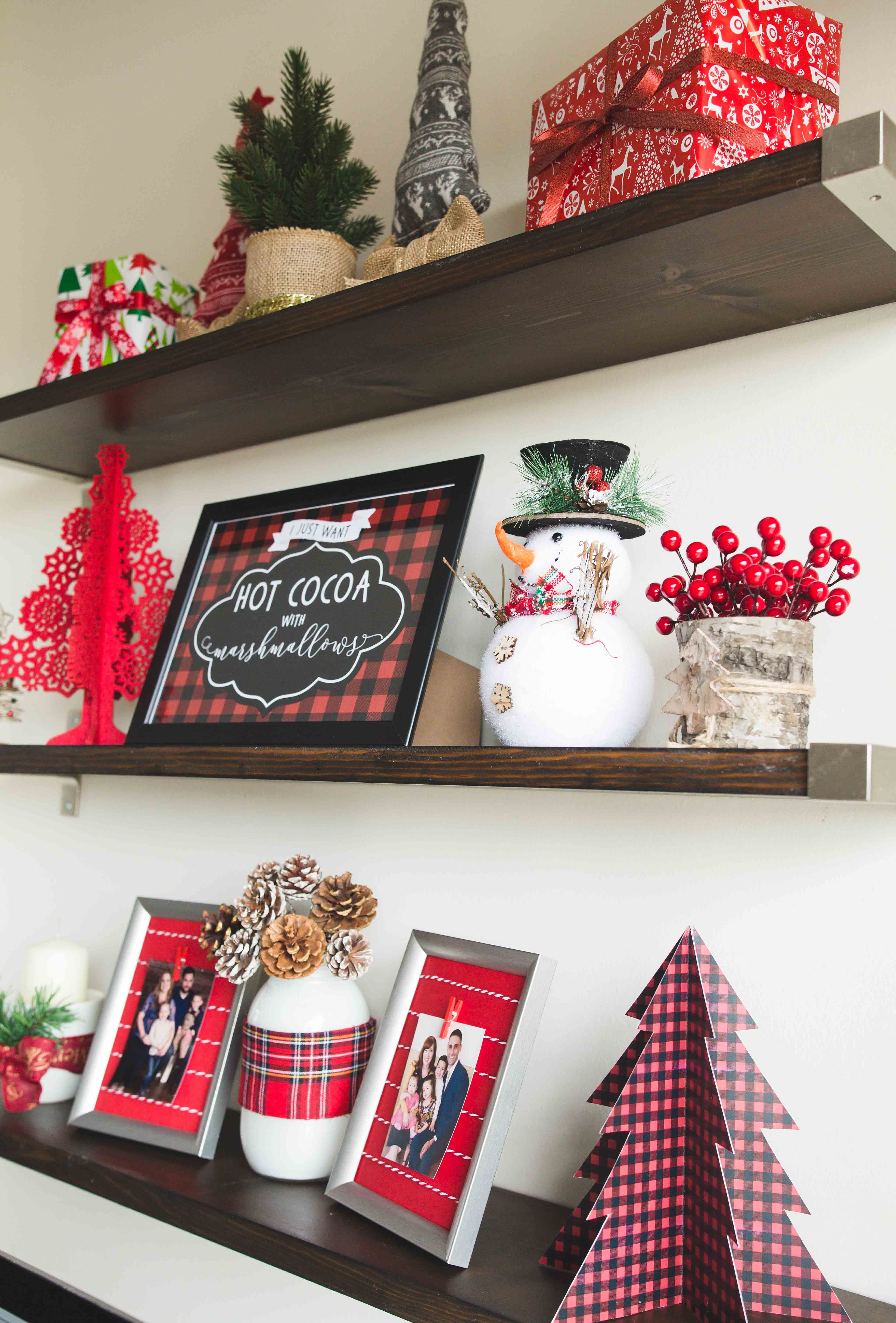 Decorating floating shelves for Christmas | Christmas floating shelves | Floating Shelf Christmas decor | | Decorating Kitchen Shelves for Christmas | How to Style Floating Shelves for Christmas - Tips for styling on a budget! All the details on the Six Clever Sisters blog.