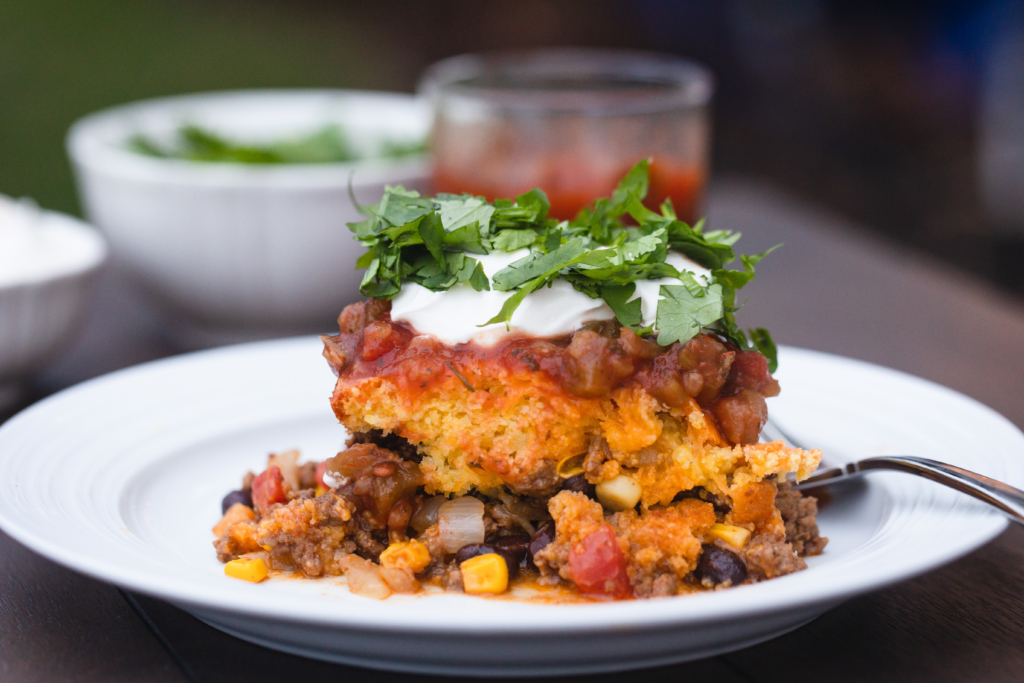 Tamale Pie | Tamale Pie Recipe | Tamale Pie Jiffy | Jiffy Corn Muffin | Mexican Dish | Mexican Casserole | Tamale Casserole | Easy Tamale Pie | This easy tamale pie recipe is made with a Jiffy corn muffin mix and is a great weeknight dinner recipe for your busy family! Recipe at SixCleverSisters.com