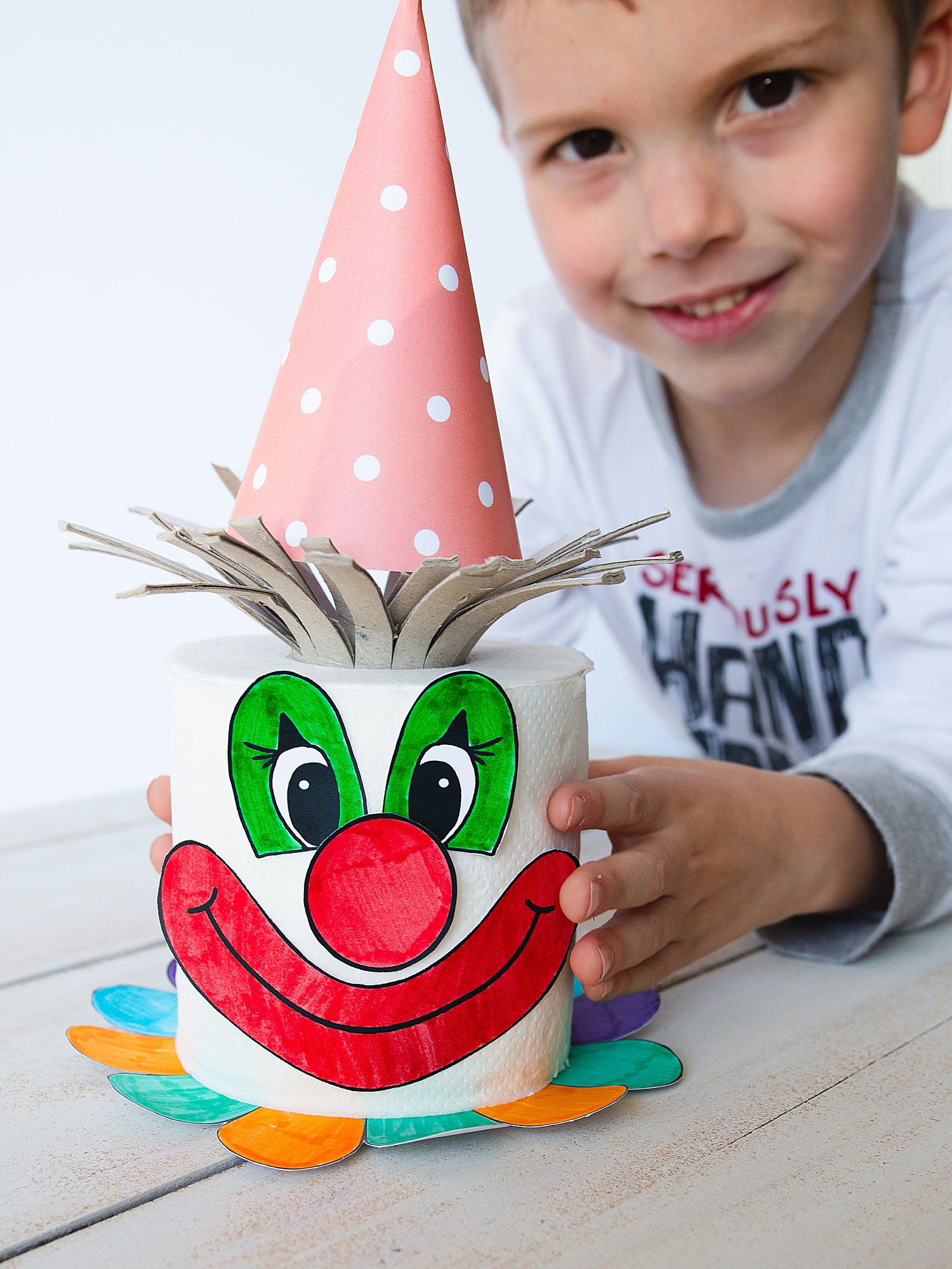 Toilet Paper Clown Kids Craft | Clown Crafts for Kids | Clown Crafts Preschool | Toilet Paper Crafts for Kids | Clown craft that you make on a full roll of toilet paper has free printables on the Six Clever Sisters blog!