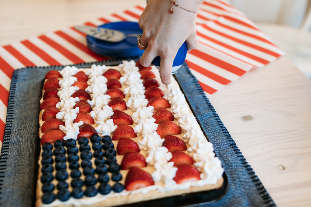 Flag Fruit Pizza | Fruit Pizza Recipe | Fourth of July Recipe | Patriotic Dessert | American Flag Dessert | Summer Picnic Dessert | Fruit Pizza Dessert | This yummy and easy-to-make flag fruit pizza is great for any July Fourth celebration! Find the recipe at SixCleverSisters.com