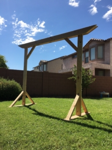 Wedding Arbor | Wedding Arch | Wedding Decor | Rustic Wedding | Wood Arbor | Wedding Ceremony Decor | Learn how to build these beautiful heavy duty arbor for a fraction of the price you would pay to buy one already made! Find the tutorial at SixCleverSisters.com