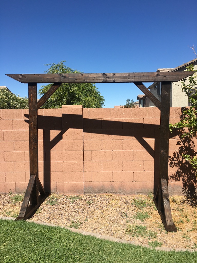 Wedding Arbor | Wedding Arch | Wedding Decor | Rustic Wedding | Wood Arbor | Wedding Ceremony Decor | Learn how to build these beautiful heavy duty arbor for a fraction of the price you would pay to buy one already made! Find the tutorial at SixCleverSisters.com