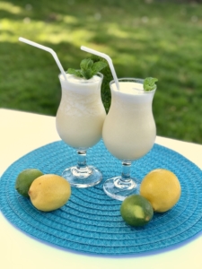 Tropical Drink | Summer Drink Recipe | Coconut Smoothie | Pineapple Drink | Fruity Drink | Drink Recipe | Easy Punch Recipe | Caribbean Breeze Drink | If you love tropical flavors and creamy sweet drinks, this Caribbean Breeze Drink is the recipe for you! Find it at SixCleverSisters.com.