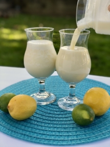 Tropical Drink | Summer Drink Recipe | Coconut Smoothie | Pineapple Drink | Fruity Drink | Drink Recipe | Easy Punch Recipe | Caribbean Breeze Drink | If you love tropical flavors and creamy sweet drinks, this Caribbean Breeze Drink is the recipe for you! Find it at SixCleverSisters.com.