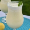 Tropical Drink | Summer Drink Recipe | Coconut Smoothie | Pineapple Drink | Fruity Drink | Drink Recipe | Easy Punch Recipe | Caribbean Breeze Drink | If you love tropical flavors and creamy sweet drinks, this Caribbean Breeze Drink is the recipe for you! Find it at SixCleverSisters.com.