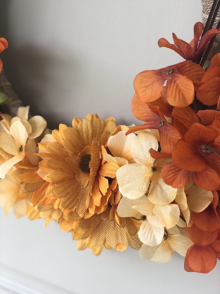 Fall Wreath | Dollar Tree | Autumn Decor | Easy Handmade Wreath | Dollar Tree Decor | Dollar Tree Hack | DIY Fall Wreath | DIY Fall Decor | Cheap Fall Wreath | Dollar Tree has all the florals and supplies you need to make yourself a beautiful fall wreath this year! Find out how I made mine at SixCleverSisters.com