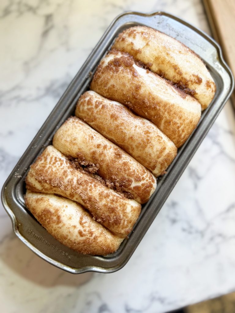 Easy Cinnamon Bread | Dollywood | Dolly Parton | Cinnamon | Frozen bread dough | Pull apart bread | Breakfast | Pastry | Easy Recipe | Easy Breakfast | Easy Dessert | Simple Bread | Dessert | Cinnamon Rolls | Homemade Bread | Homemade cinnamon bread | Six Clever Sisters