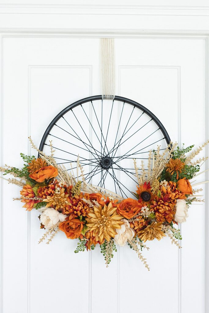 Bicycle Wheel Wreath | Bicycle Wheel Wreath DIY | Bicycle Wheel Wreath Fall | Modern Farmhouse Bicycle Wheel Wreath | Fall wreath in Modern Farmhouse style starts with a bike wheel! Instructions for this fall bike wheel wreath on the Six Clever Sisters blog.